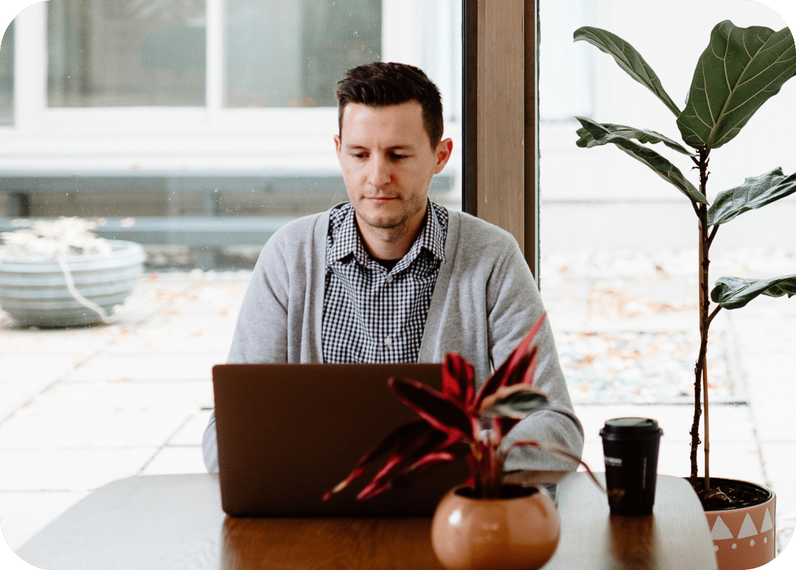image of man using his laptop