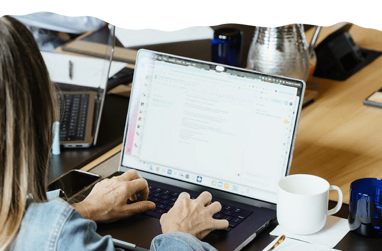 woman typing on laptop