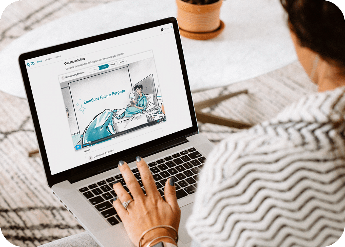 image of woman using lyra product on her laptop